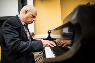 Jay Reise playing piano